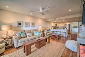 a living room with a couch and a table at Family-Friendly Brigantine Condo Near Beach! in Brigantine