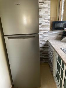 a stainless steel refrigerator in a kitchen at Marbella1 in Los Frailes
