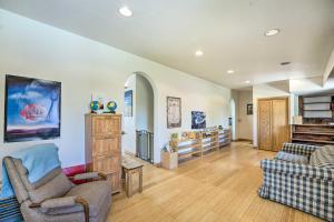a living room with two chairs and a couch at Lakefront Country Home with Waterslide and Trampoline! in Wheatland