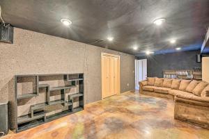 a living room with a couch and a fireplace at Lakefront Country Home with Waterslide and Trampoline! in Wheatland