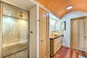 a bathroom with a walk in shower and a sink at Lakefront Country Home with Waterslide and Trampoline! in Wheatland