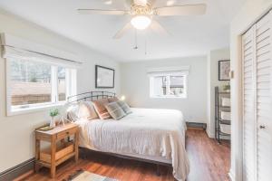 a bedroom with a bed and a ceiling fan at 225 6th Avenue Unit 3 in Ouray