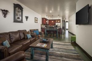 a living room with a couch and a table at La Dolce Vita Villas 10 in Moab