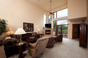 a living room with a couch and a fireplace at 210 Cypress Court in Hermosa