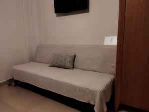 Posteľ alebo postele v izbe v ubytovaní Cozy Apartment in the Heart of Thessaloniki