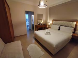 Posteľ alebo postele v izbe v ubytovaní Cozy Apartment in the Heart of Thessaloniki