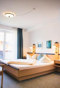 a bedroom with a large bed in a room at Gästehaus Germania in Schönau am Königssee
