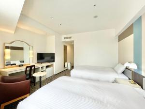 Postel nebo postele na pokoji v ubytování Chisun Hotel Yokohama Isezakicho