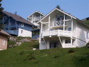 a large white house with a balcony on a hill at Chalet Flaine, 5 pièces, 8 personnes - FR-1-425-123 in Flaine