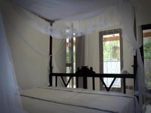 Ένα ή περισσότερα κρεβάτια σε δωμάτιο στο Singha Holidays