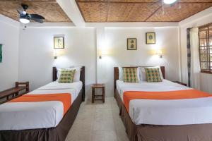 Postel nebo postele na pokoji v ubytování Oasis Resort