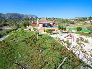 an aerial view of a house with a playground at Spacious Home in Teulada in Teulada