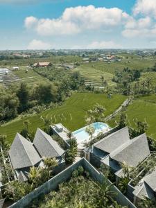 an aerial view of a resort with a swimming pool at Astera Resort Canggu by Ini Vie Hospitality in Canggu