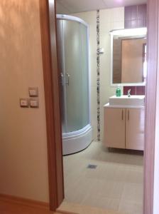 a bathroom with a shower and a sink at Sunnyview Park Ohrid apartments in Ohrid