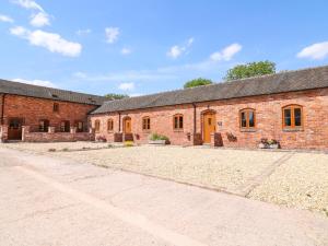 an old brick building with a driveway in front of it at Robin's Rest in Stoke on Trent