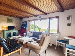 a living room with a couch and a table at 5 person holiday home in Roslev-By Traum in Sønder Thise