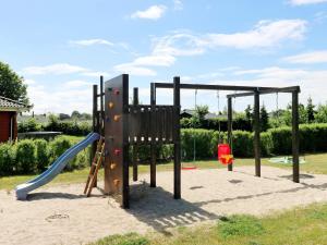 un parque infantil con tobogán en 10 person holiday home in Hadsund, en Hadsund