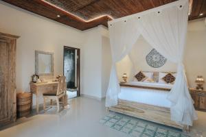 Ein Bett oder Betten in einem Zimmer der Unterkunft Sitala Suite