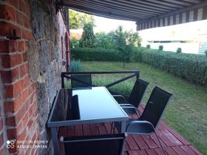 a table and chairs sitting on a patio at P-4 in Retowo