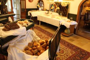 a room with two tables and a table with food at Hotel Altes Rittergut in Sehnde