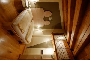 an overhead view of a bedroom with a bed and a staircase at Chalet C'Est La Vie in Livigno
