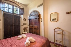 Кровать или кровати в номере Poggio Primo - Bilocale Vermiglio
