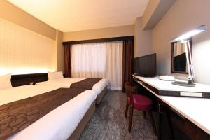 En eller flere senger på et rom på Nagoya Fushimi Mont-Blanc Hotel