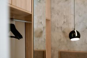 a black pendant light is hanging in a room at Summer Feelings in Skala Sotiros
