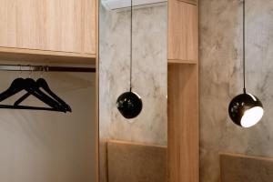 two lights hanging from a wall in a room at Summer Feelings in Skala Sotiros