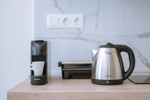 two coffeemakers sitting on a counter with a coffee maker at Summer Feelings in Skala Sotiros