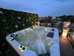 a jacuzzi tub on the roof of a house at NEW 2022 Grand Deluxe ART Pool Villa in Jomtien Beach