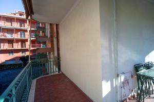 a balcony of a apartment building with a balcony istg istg at [PIETRA LIGURE] The apartment for your vacations. in Pietra Ligure