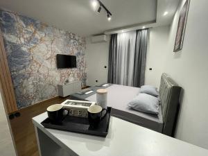 Televízia a/alebo spoločenská miestnosť v ubytovaní AD luxury