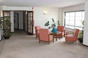 Uma área de estar em Hotel Santa Maria