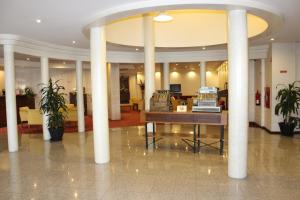 O saguão ou recepção de Hotel Santa Maria