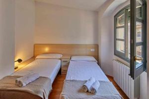 Posteľ alebo postele v izbe v ubytovaní Apartamento Francesc Samsó Girona