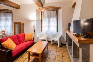 Televízia a/alebo spoločenská miestnosť v ubytovaní Apartamento Francesc Samsó Girona