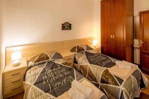 Posteľ alebo postele v izbe v ubytovaní Apartamento Francesc Samsó Girona