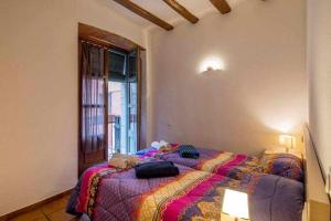 Posteľ alebo postele v izbe v ubytovaní Apartamento Francesc Samsó Girona