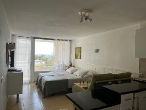 Posteľ alebo postele v izbe v ubytovaní Borinquen Studio Apartment