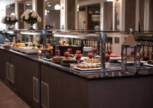 a buffet line with many different types of desserts at Azul Beach Resort Montenegro by Karisma - All Inclusive in Ulcinj