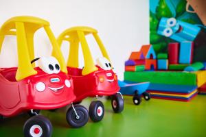 a toy red train with two faces on it at Azul Beach Resort Montenegro by Karisma - All Inclusive in Ulcinj