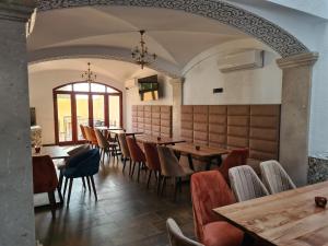 a restaurant with tables and chairs and a window at Mahdia - Baghdadi - Laourient Apartments, restaurant, café in Mahdia