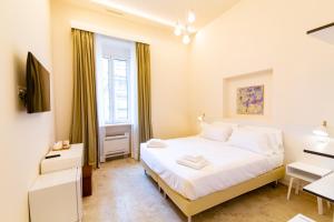 A bed or beds in a room at Migliori Olive Ascolane beds