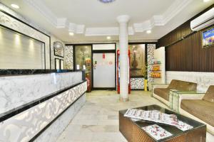 a restaurant with a counter and a table at Hotel sallow International-Hotel Near Golden Temple in Amritsar
