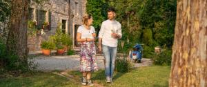 a man and a woman walking through a yard at Antica Corte in Soave +43 photos
