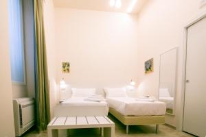 A bed or beds in a room at Migliori Olive Ascolane beds