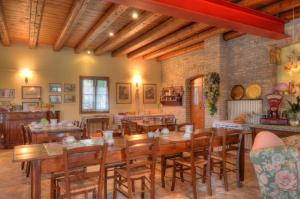 a dining room with wooden tables and chairs at Agriturismo Albafiorita in Latisana