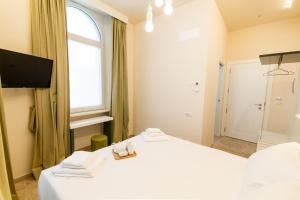A bed or beds in a room at Migliori Olive Ascolane beds