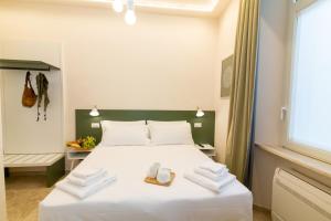 A bed or beds in a room at Migliori Olive Ascolane beds